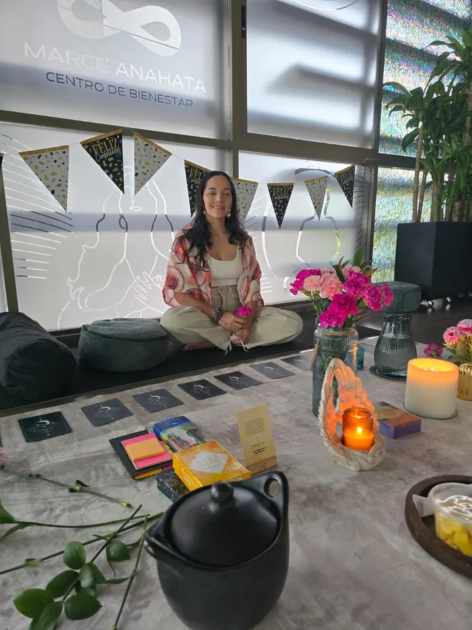 Birthday altar with candles, flowers and intention cards